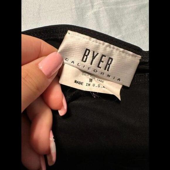 Be the Life of the Party with this Chic Black Halter Flowy Top! - Picture 3 of 3